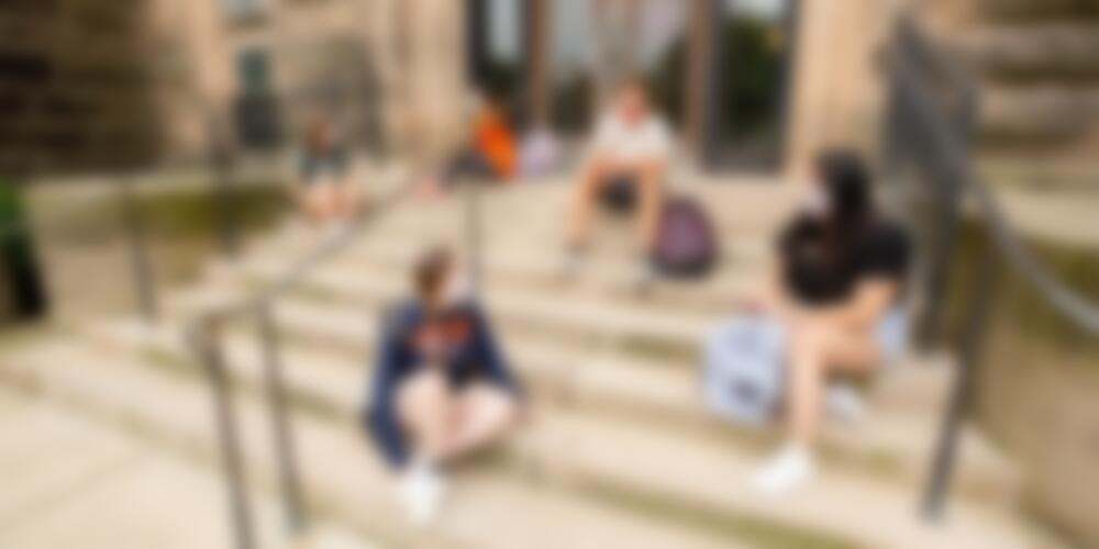 photo of students sitting on steps